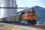 BNSF 7767, GE ES44DC (GEVO), is westbound working as a DPU unit on the rear of a hopper train 